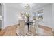 Formal dining room with hardwood floors, a round table, and a chandelier at 800 Landau Rd, Waxhaw, NC 28173