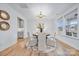 Elegant dining room with hardwood floors, a round table, and stylish light fixture at 800 Landau Rd, Waxhaw, NC 28173