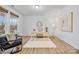 Home office featuring hardwood floors, a large window, and stylish furniture at 800 Landau Rd, Waxhaw, NC 28173