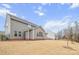 Gray siding two story house with a backyard and partially visible pool at 800 Landau Rd, Waxhaw, NC 28173