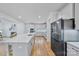 Modern kitchen with large island and stainless steel appliances at 800 Landau Rd, Waxhaw, NC 28173