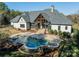 Aerial view of luxury home with in ground pool, patio and well manicured landscape at 9809 Saddle Ave, Waxhaw, NC 28173