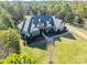 Luxury home on large lot with circular driveway and lush landscaping at 9809 Saddle Ave, Waxhaw, NC 28173