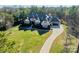 Aerial view of luxury home with long driveway and lush greenery, perfect for privacy at 9809 Saddle Ave, Waxhaw, NC 28173