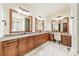 Beautiful bathroom featuring dual sinks, granite countertops, and custom cabinetry at 9809 Saddle Ave, Waxhaw, NC 28173