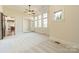 Comfortable bedroom with carpet, ceiling fan, and views to the kitchen at 9809 Saddle Ave, Waxhaw, NC 28173