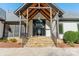 Stunning entryway with stone steps, wood beams, and a large glass front door that welcomes you home at 9809 Saddle Ave, Waxhaw, NC 28173
