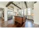 Bright kitchen featuring custom cabinets, stainless steel appliances, and an island with sink at 9809 Saddle Ave, Waxhaw, NC 28173