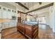 Spacious kitchen features a large center island, custom cabinets and hardwood floors at 9809 Saddle Ave, Waxhaw, NC 28173