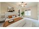 Bright main bedroom featuring a ceiling fan, neutral walls, and a large window for ample natural light at 9809 Saddle Ave, Waxhaw, NC 28173