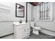 Small basement bathroom with white vanity and toilet at 106 Patrick St, Gastonia, NC 28054