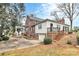 Back exterior showcasing a deck and landscaping at 106 Patrick St, Gastonia, NC 28054