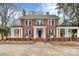 Brick home with a large front porch and landscaped yard at 106 Patrick St, Gastonia, NC 28054
