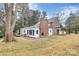 Brick house with white addition and a stone patio at 106 Patrick St, Gastonia, NC 28054