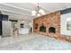 Open concept kitchen and dining area with brick fireplace at 106 Patrick St, Gastonia, NC 28054