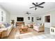Spacious living room with ceiling fan, hardwood floors, and neutral decor at 106 Patrick St, Gastonia, NC 28054