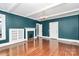 Living room with hardwood floors and built-in shelving at 106 Patrick St, Gastonia, NC 28054