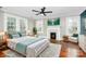 Virtually staged main bedroom with fireplace and hardwood floors at 106 Patrick St, Gastonia, NC 28054