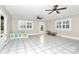 Sunroom with tile flooring, ceiling fans, and plenty of natural light at 106 Patrick St, Gastonia, NC 28054