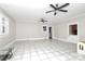 Sunroom with tile flooring, ceiling fans, and access to backyard at 106 Patrick St, Gastonia, NC 28054