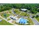 Aerial view of community pool, playground, and parking at 126 Oakley Dr, Harrisburg, NC 28075