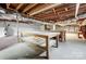 Unfinished basement with workshop benches and shelving at 126 Oakley Dr, Harrisburg, NC 28075