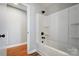 Updated bathroom with a tub shower combo and built-in shelves at 126 Oakley Dr, Harrisburg, NC 28075