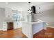 Modern kitchen with white cabinets and island at 126 Oakley Dr, Harrisburg, NC 28075