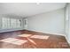 Sunroom with terracotta tile floor and large windows at 126 Oakley Dr, Harrisburg, NC 28075