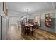 Open concept dining room with a wooden table and chairs, adjacent to kitchen at 1278 Burrell Rd, Clover, SC 29710