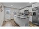 Modern kitchen with white cabinets, granite island, and stainless steel appliances at 1278 Burrell Rd, Clover, SC 29710