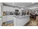 Modern kitchen with white cabinets, granite island, and stainless steel appliances at 1278 Burrell Rd, Clover, SC 29710