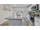 Modern kitchen with white cabinets, granite island, and stainless steel appliances at 1278 Burrell Rd, Clover, SC 29710