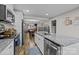 Modern kitchen with white cabinets, granite island, and stainless steel appliances at 1278 Burrell Rd, Clover, SC 29710