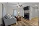 Living room features a gray sectional sofa, coffee table, and fireplace at 1278 Burrell Rd, Clover, SC 29710