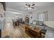 Living room with gray sectional sofa, coffee table, and ceiling fan at 1278 Burrell Rd, Clover, SC 29710