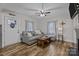 Cozy living room featuring a comfortable sectional sofa and wood-look floors at 1278 Burrell Rd, Clover, SC 29710