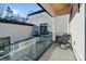 Private balcony with glass railings and a rocking chair at 15650 Youngblood Rd, Charlotte, NC 28278