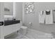 Elegant bathroom with floating vanity and marble floor at 15650 Youngblood Rd, Charlotte, NC 28278