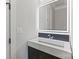 Modern bathroom with floating vanity and illuminated mirror at 15650 Youngblood Rd, Charlotte, NC 28278