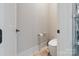 Simple yet elegant powder room with a modern toilet and sink at 15650 Youngblood Rd, Charlotte, NC 28278