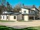 Contemporary home with attached garage and landscaped yard at 15650 Youngblood Rd, Charlotte, NC 28278