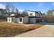 Contemporary home with attached garage and landscaped yard at 15650 Youngblood Rd, Charlotte, NC 28278