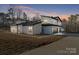 Modern two-story home with sleek design and expansive windows at 15650 Youngblood Rd, Charlotte, NC 28278