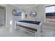Modern game room with a pool table and plenty of natural light at 15650 Youngblood Rd, Charlotte, NC 28278