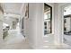 Bright hallway with marble floors and modern lighting at 15650 Youngblood Rd, Charlotte, NC 28278