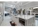 Modern kitchen with marble countertops, stainless steel appliances, and large island at 15650 Youngblood Rd, Charlotte, NC 28278