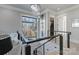 Bright landing area overlooking the entryway with chandelier at 15650 Youngblood Rd, Charlotte, NC 28278