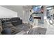 Bright living room featuring a sectional sofa, fireplace, and large TV at 15650 Youngblood Rd, Charlotte, NC 28278