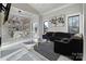 Open concept living area with modern furniture and large windows at 15650 Youngblood Rd, Charlotte, NC 28278